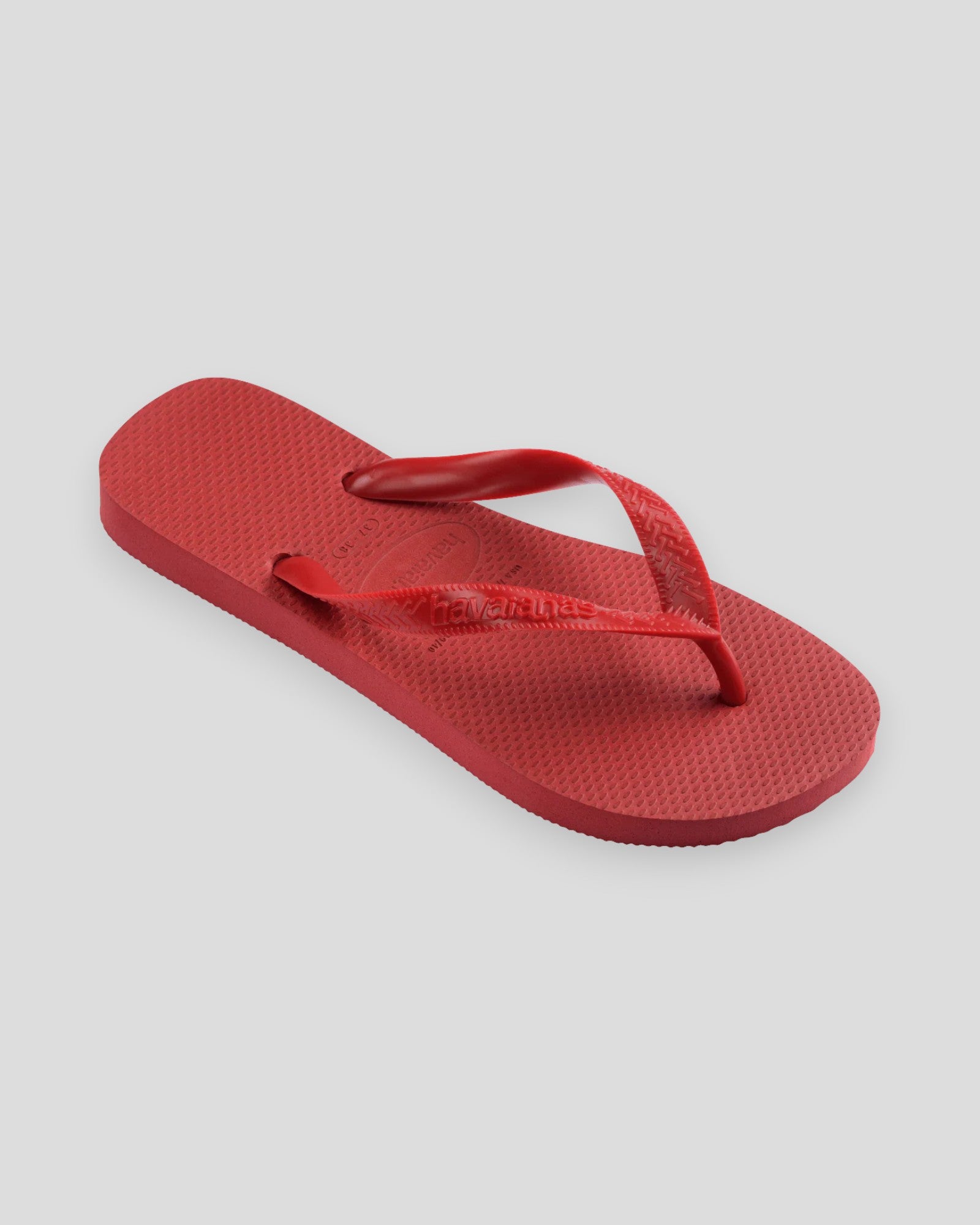Røde Havaianas sandaler til kvinder med åbent tådesign og flad sål, perfekte til sommerbrug.