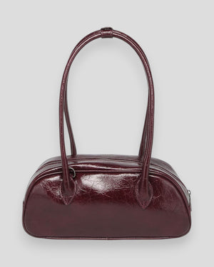 Noella Iris Bag in burgundy, stylish women's handbag with a sleek design and adjustable strap.