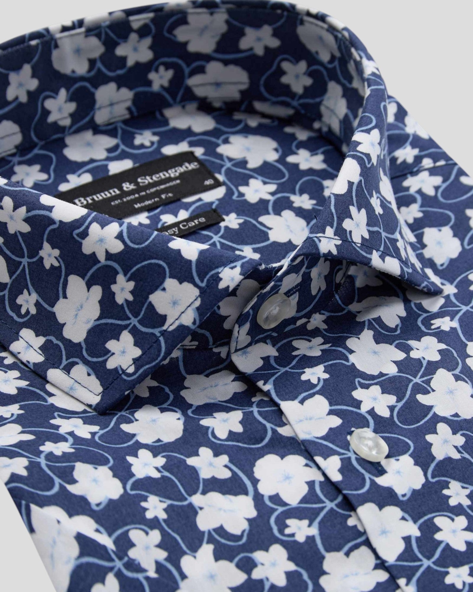 Dark blue Arpad modern fit shirt by Bruun & Stengade, displayed flat showing collar, buttons, and tailored fit details.