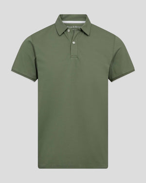 Green Bruun & Stengade Delos regular fit polo shirt displayed on a mannequin with a collar and short sleeves.